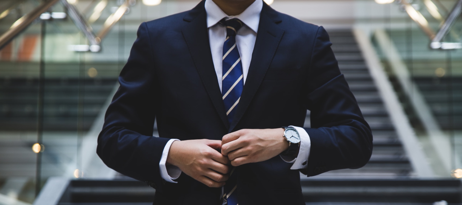 Businessman adjusting his suit
